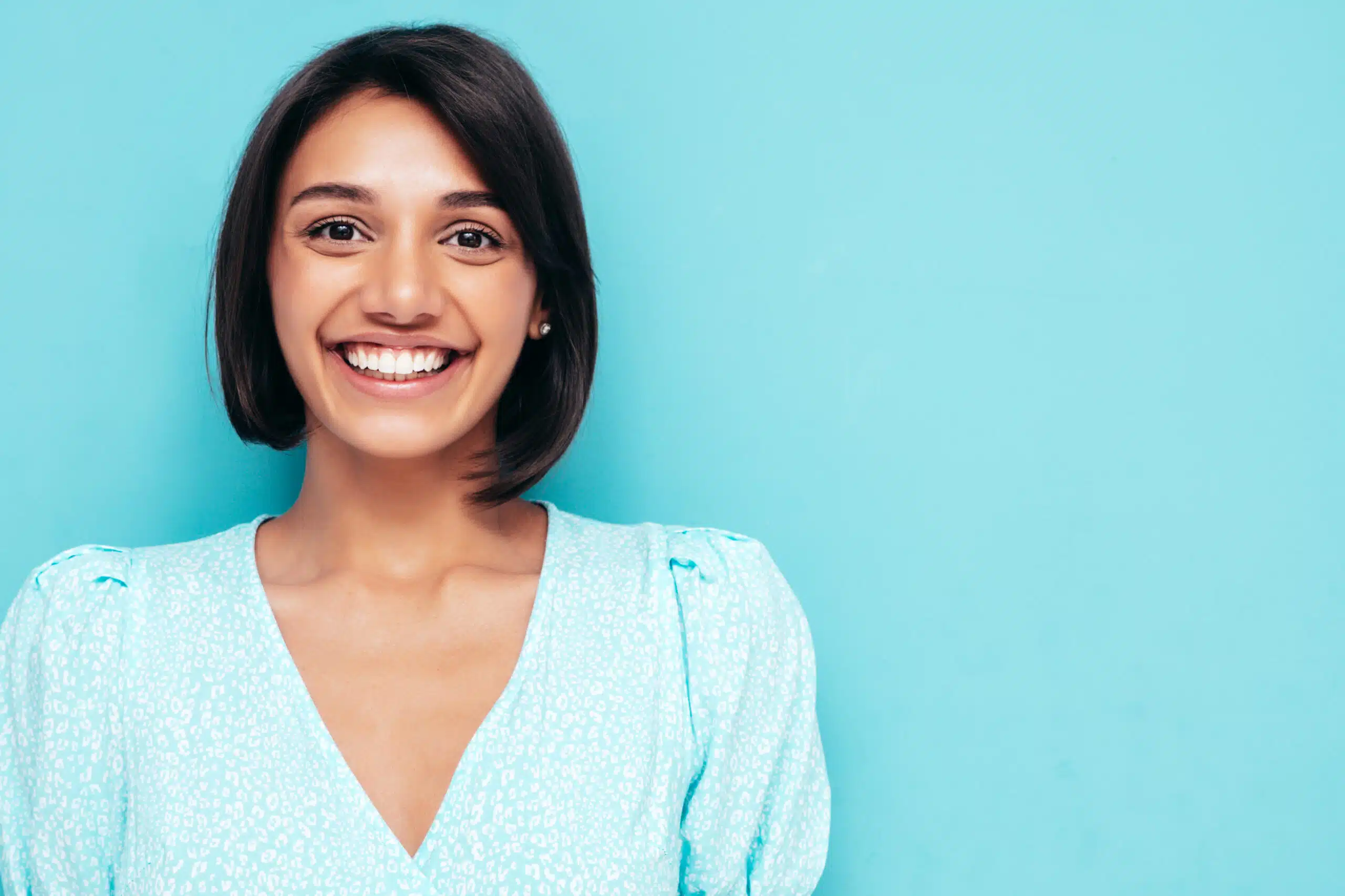 A smiling woman with a bright, healthy smile